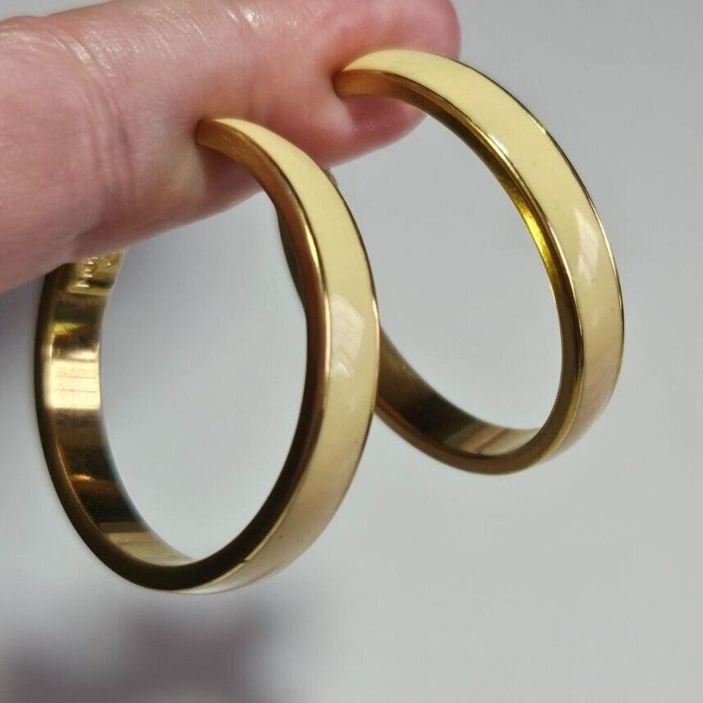Monet gold tone cream enamel hoop clip on earrings
